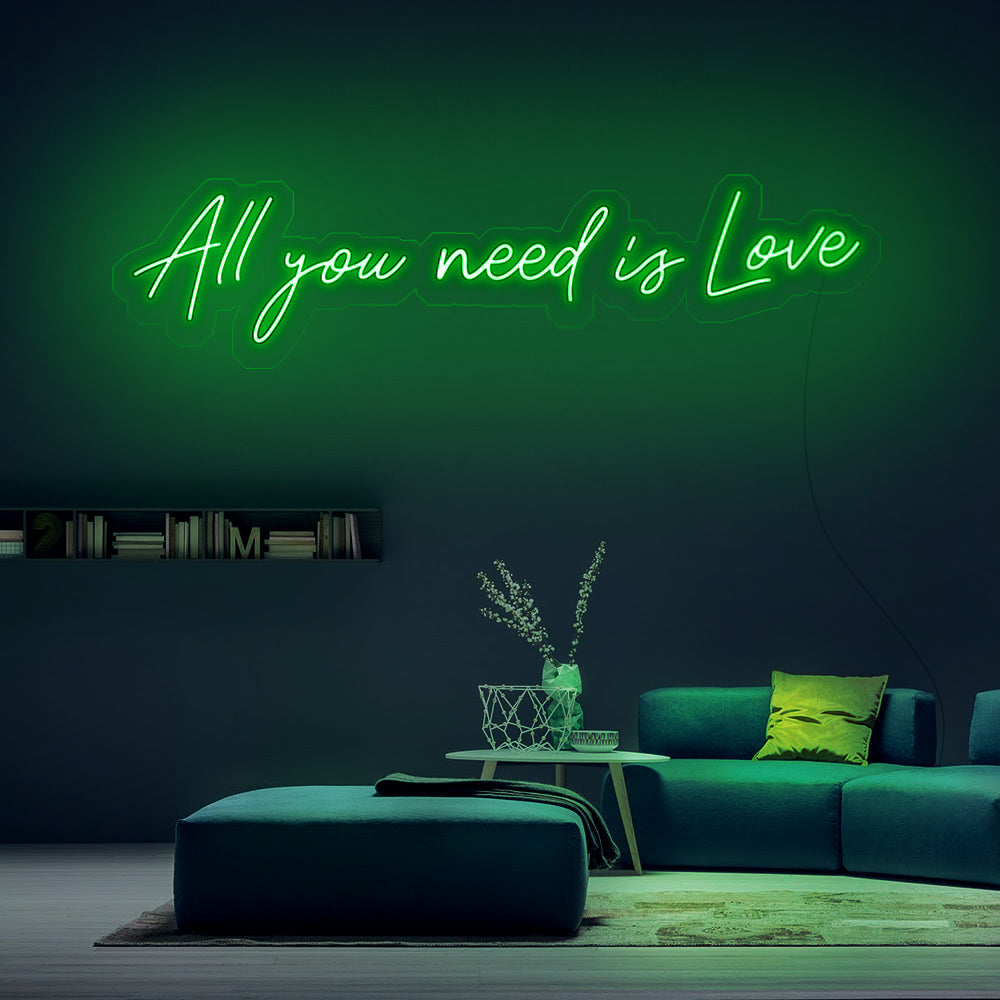 Groene neon verlichting met de tekst All You Need Is Love